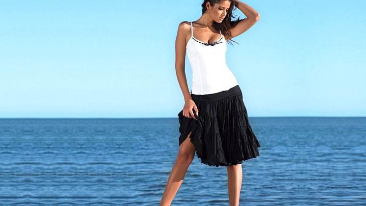 Carla Ossa In White Top And Black Skirt Modeling Pose At Sea Side